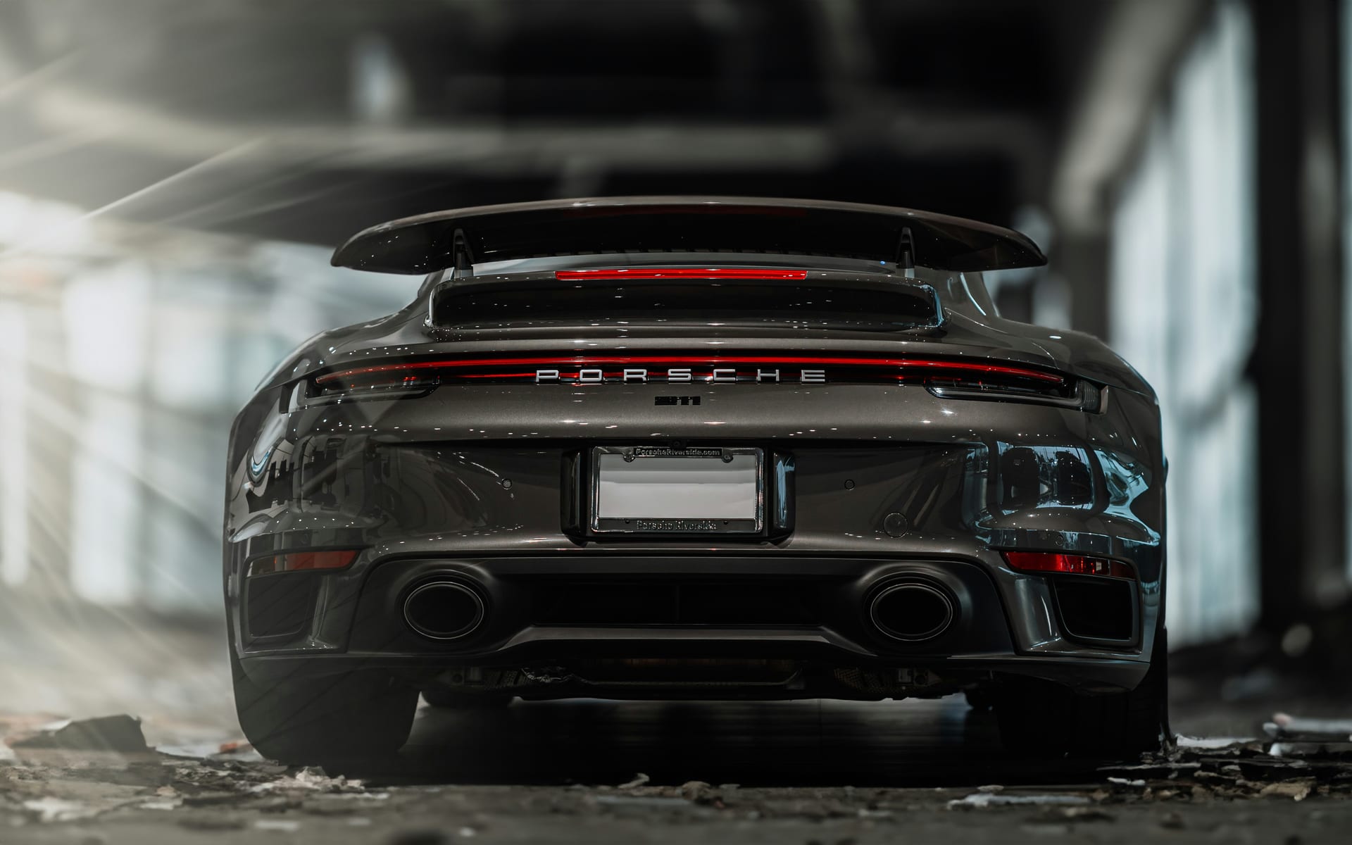 Black paint showing swirl marks and haze before correction